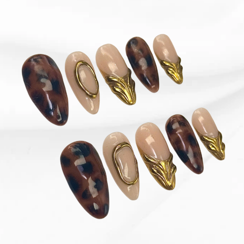 nude and tortoiseshell gel nails with sculpted gold charm Fierce Shell Gold