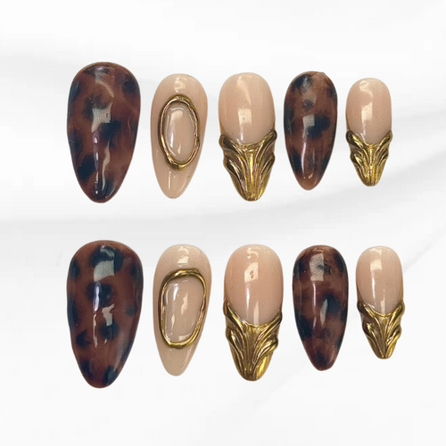 Fierce Shell Gold tortoise shell press-on nails with gold metal accents

