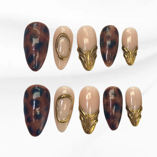 Fierce Shell Gold tortoise shell press-on nails with gold metal accents


